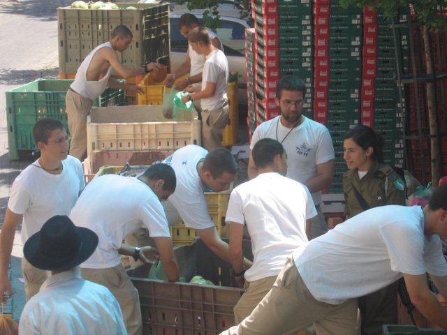 IDF soldiers came to pack food baskets for the needy
